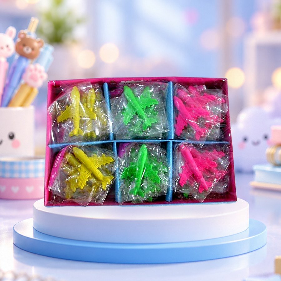 Airplane Eraser: airplane erasers in a display tray, on a pastel blue podium — wholesale kawaii erasers from Tirth Enterprise
