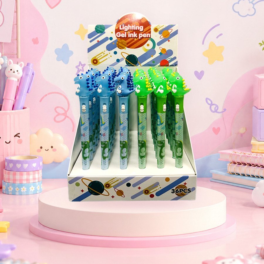 LED Pen (Dino): light-up LED gel pens with dinosaur toppers in a display box, on a pink kawaii desk — wholesale kawaii pens from Tirth Enterprise